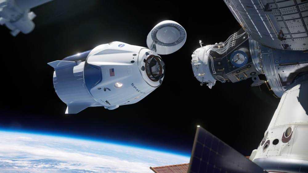 The Dragon has landed: SpaceX capsule docks at International Space Station Photograph